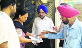 Health teams distribute chlorine tablets to residents at Bharatpur locality in Jalandhar on Saturday