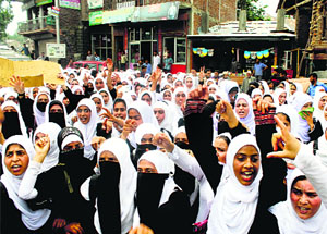 College students raise anti-Israel slogans during a protest in Pulwama district on Saturday.