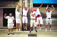 French Basques leap in the air as they pose for a picture during the San Fermin festival in Pamplona on Saturday