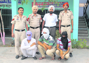 The opium smugglers in police custody in Bathinda on Sunday. 
