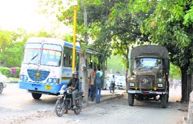 A police vehicle plies on a lane meant for two-wheelers near Airport Chowk in Chandigarh
