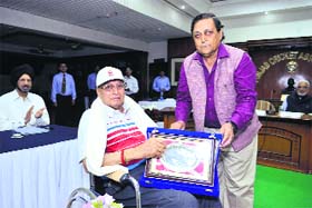 MP Pandove, Honorary Secretary,  PCA, presents a silver salver to Gurpal Singh during the annual awards function at the PCA Stadium in Mohali
