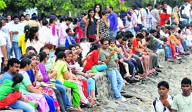 Residents enjoy an evening at Sukhna Lake after rain in Chandigarh on Sunday