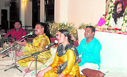 Art of Living members recite bhajans to celebrate Guru Purnima in Dehradun on Saturday