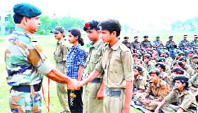 Lt Col Mangat Saini, Commanding Officer of the Una NCC unit, honours the winners of various competitions at Jawahar Navodaya Vidyalaya at Pekhubela village in Una on Sunday.