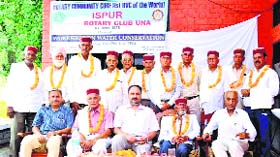 GS Sekhon, governor of the Rotary District 3070, with charter members of the RVC, Ispur, in Una on Saturday.