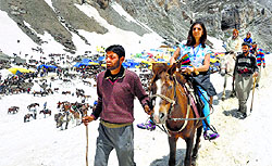 A pilgrim on his way to Amarnath shrine on Sunday