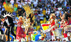 Colombian singer Shakira (2L) performs during the closing ceremony of the 2014 FIFA World Cup at the Maracana Stadium in Rio de Janeiro, Brazil, on Sunday