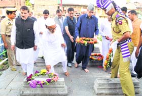 Chief Minister Omar Abdullah along with senior cabinet members lays a wreath on the graves of the 1931 martyrs