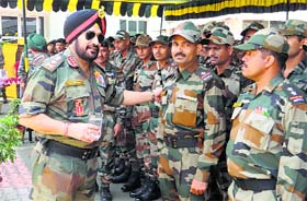 Farewell visit: Army Chief General Bikram Singh with troops at the Northern Command in Udhampur on Sunday