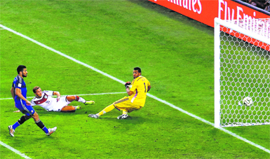 Germanys Mario Gotze scores the winner past Argentinas goalkeeper Sergio Romero in the final in Rio de Janeiro on Sunday.