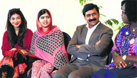 Malala Yousafzai (2nd L) sits with her father Ziauddin Yousafzai (2nd R) and Malala Fund CEO Shiza Shahid (L) during a meeting with the leaders of the #BringBackOurGirls Abuja campaign group, in Abuja on Sunday.