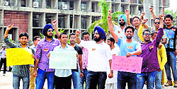 ABVP activists stage a protest at Panjab University in Chandigarh on Monday
