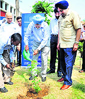 Justice SS Sodhi, former Chief Justice of the Allahabad HC, waters a plant during a plantation drive at the GMSSS in Sector 10, Chandigarh, on Monday