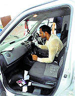 A forensic team examines jewellery showroom owner Aashi Khannas car that was abandoned by the robbers