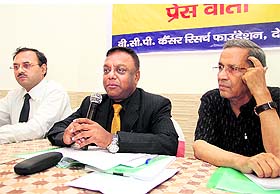 Vaidya Balendu and Prof AN Purohit (right) address mediapersons in Dehradun on Monday.