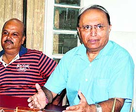 Dr Devendra Bhaseen, Principal of DAV PG College, addresses a press conference in Dehradun on Monday.