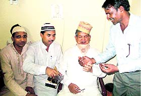 Chief Minister Harish Rawat with Rozedars from Haridwar at AIIMS in Delhi.