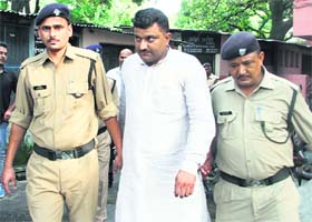 Congress leader Pradeep Sangwan in police custody in Dehradun on Monday