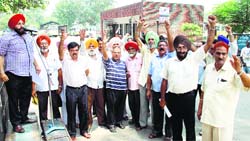 Punjab Roadways employees stage protest in Jalandhar on Monday. Photo: Sarabjit Singh