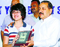 Union minister Jitendra Singh gives an award to a meritorious student in New Delhi on Monday