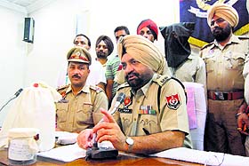 The police show the seized heroin to the media in Ludhiana.
