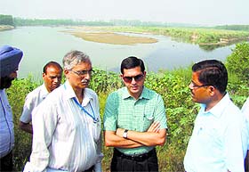 Deputy Commissioner Rajat Aggarwal (centre) and members of a team from Engineers India Limited visit a site on the Budha Nullah in Ludhiana on Monday.