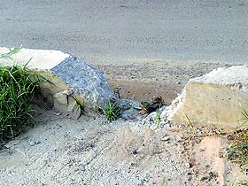 a damaged portion of the Sahnewal overbridge.