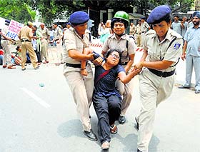  Police detain a JNU student during a demonstration against Israeli attacks on Gaza outside the Israeli Embassy in New Delhi on Monday. 