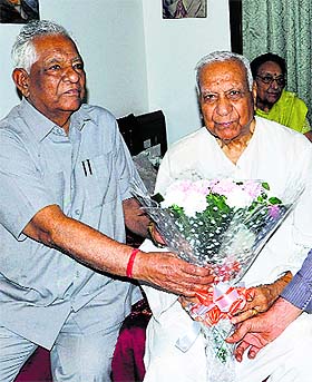 Balramji Das Tandon (R) being congratulated by Punjab minister Chuni Lal Bhagat at his residence on Monday. 
