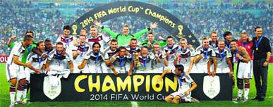 German players celebrate with the trophy at the Maracana Stadium in Rio de Janeiro, Sunday. Germany won the match 1-0.