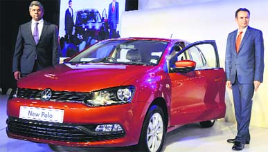 Volkswagen Passenger Cars India director Michael Mayer (R) and Volkswagan India managing director Mahesh Kodumudi pose with the new Polo at its launch in New Delhi on Tuesday.