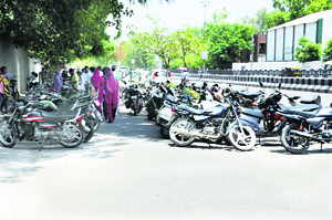 Wrongly parked two-wheelers on a slip road blocking the traffic outside Government Rajindra College in Bathinda on Tuesday. 