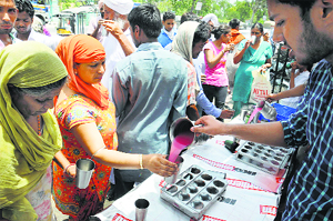 Sweetened water being offered at a chhabeel near the Civil Hospital in Bathinda on Tuesday.