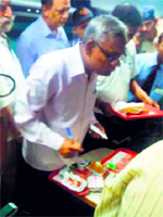 Railway officials inspect the food at Ambala station