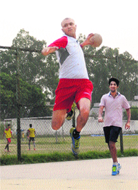 Sachin Chaudhary, an International handball player, attempts a shot during a practice match at a coaching centre in Sector 8, Chandigarh, on Tuesday. The exhibition match was played between senior handball players and young trainees of the centre. The senior group registered a marginal 25-22 victory over juniors. 