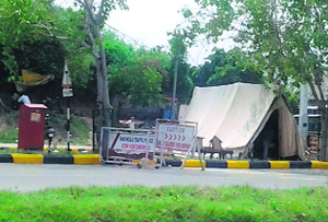 The naka opposite the jewellery showroom in the MDC wears a deserted look as policemen rest inside the tent.