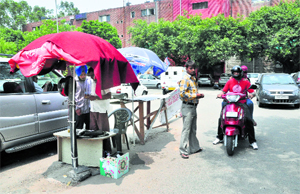 Attendants without the uniform at a parking lot in Sector 17, Chandigarh