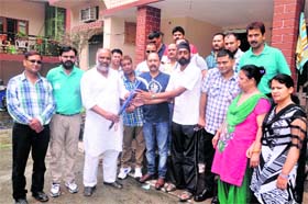 Subhash Sharma, zila panchayat member, flags off a mountaineering expedition of Opto Electronic Factory (OLF) employees in Dehradun on Monday