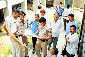Police personnel investigate the case in Mandi on Tuesday.