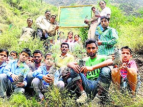 Students of Government Middle School, Selli, before going for the plantation campaign at Luna in Bharmour on Tuesday.