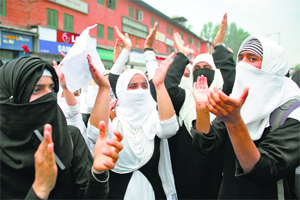Student shout anti-Israeli slogans during a protest in Srinagar.