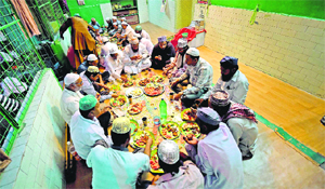 Muslims break their fast during a Ramadan get-together