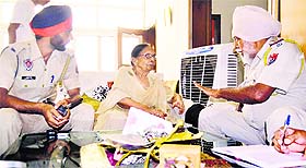 Police officials record the woman’s statement