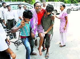 An ice-cream vendor who was allegedly detained and assaulted by his employer being taken to the Police Commissioners office in Ludhiana on Tuesday.