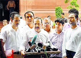 Minister of State in the Prime Ministers Office Jitendra Singh, flanked by Civil Service aspirants, talks to mediapersons at Parliament in New Delhi on Tuesday. 