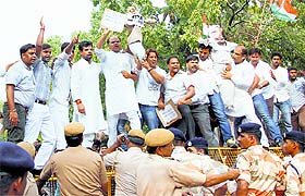 Youth Congress activists raise slogans against journalist Ved Pratap Vaidik in New Delhi on Tuesday.