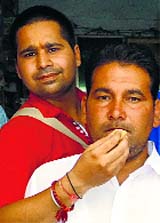 Harjinder Singh being offered sweets in Muktsar on Tuesday. 