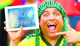 A beaming Chilie fan is smiling from ear to ear as he bids Spain goodbye from the World Cup in the first round itself.