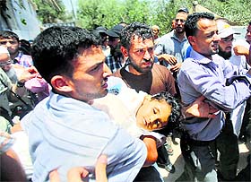Relatives carry the body of four-year-old Palestinian girl Sarah Sheik al-Eid, who was killed in an Israeli air strike, during her funeral in Rafah, Southern Gaza, on Tuesday.